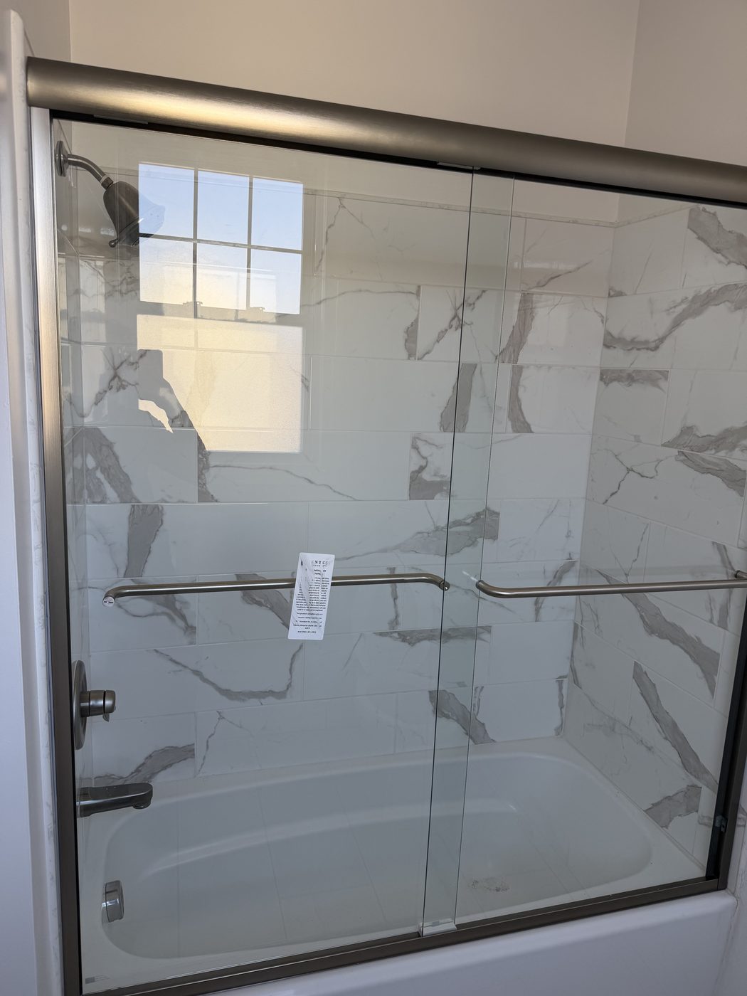 Glass shower enclosure