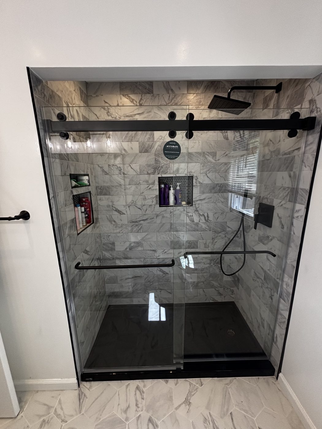 Glass shower enclosure