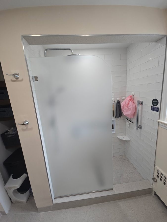 Semi-frameless shower enclosure