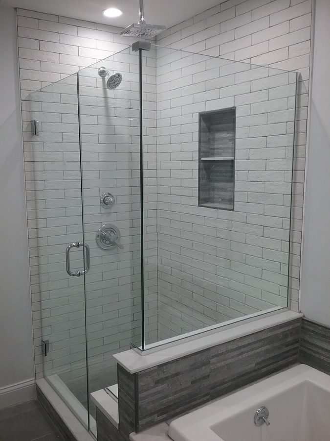 Glass shower door with chrome hardware